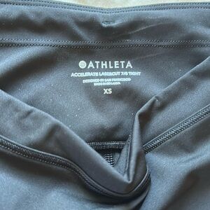 Athleta Lasercut 7/8 tights with Reflective Accents and back zipper pocket NWOT